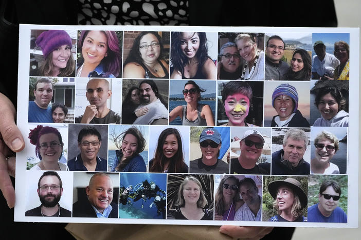 A photo collage of the 34 victims of the Sept. 2, 2019 fire aboard the dive boat, Conception, at Santa Cruz Island, is held by a family member arriving at federal court in Los Angeles, Wednesday, Oct. 25, 2023.