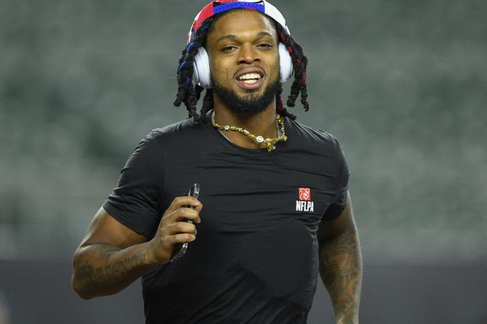 The Buffalo Bills' Damar Hamlin took 10 Cincinnati medical workers out for dinner — and told them he's setting up scholarships in their names. He's seen here before the Bills' game against the Cincinnati Bengals.