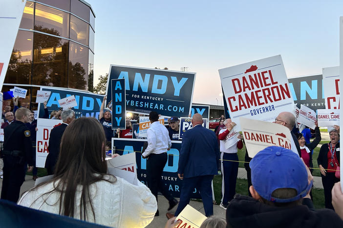 Candidates and supporters of Andy Beshear and Daniel Cameron gather ahead of a gubernatorial debate in October.