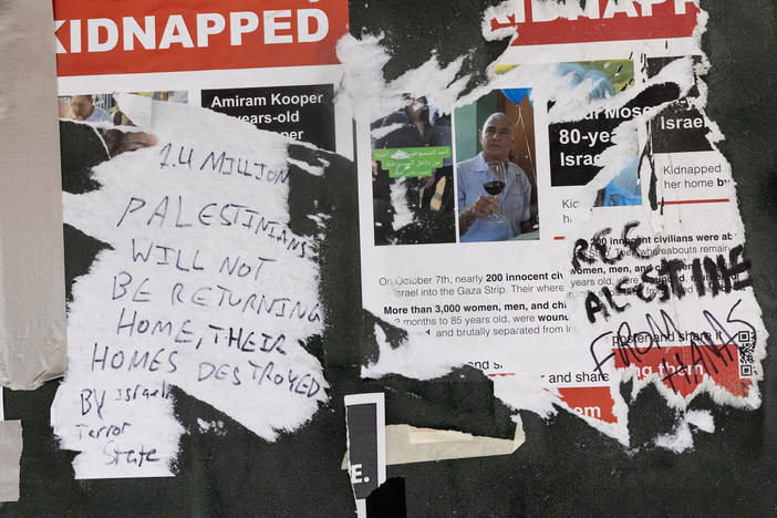 Posters hung around the New York University campus in Greenwich Village, showing people kidnapped by Hamas on Oct. 7 in Israel, are seen torn up and covered with pro-Palestinian graffiti.