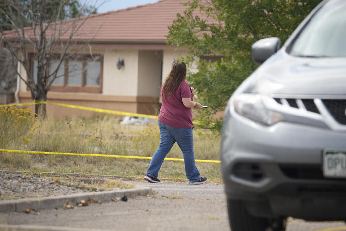 The Return to Nature funeral home is marked off with police tape on Oct. 6 in Penrose, Colo.