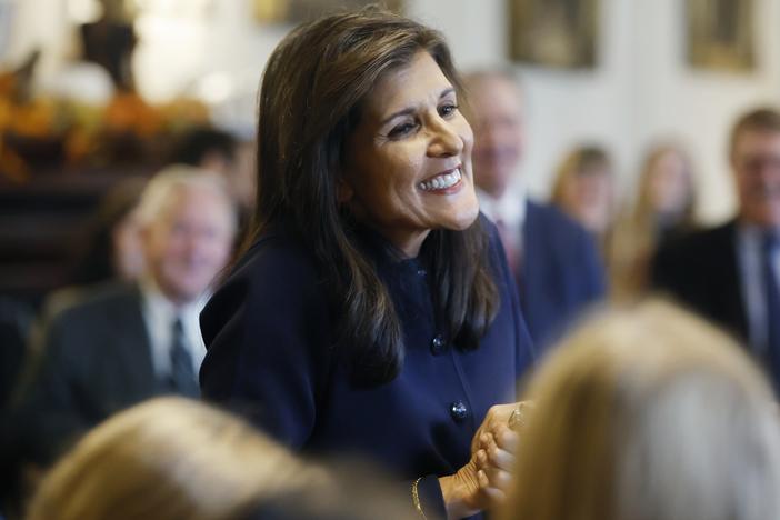 Former U.N. Ambassador Nikki Haley greets supporters after signing papers to get on the Republican presidential primary ballot at the New Hampshire Statehouse on Oct. 13 in Concord, N.H.