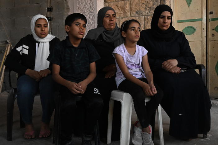 The family of Bilal Muhammed Saleh outside their home in  As-Sawiya, occupied West Bank on Oct. 31, 2023.