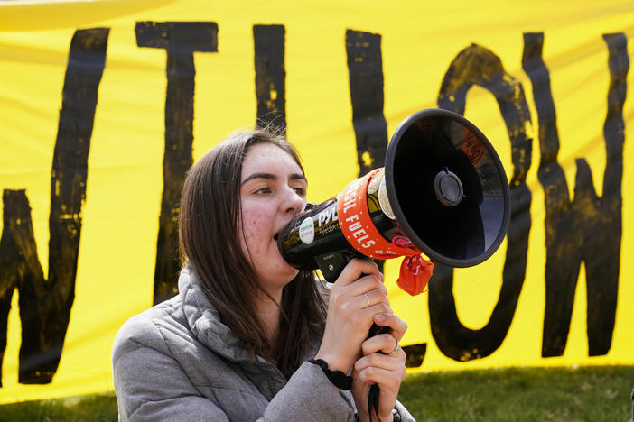 A demonstrator protests against the Biden administration's approval of the Willow oil project in Washington, Tuesday, March 21, 2023.