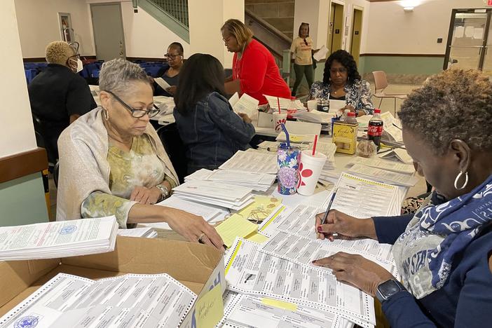 An election resolution board counts absentee ballots Wednesday, Nov. 8, 2023, at the Hinds County Courthouse in Jackson, Miss.