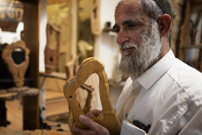 Itay Levy makes music and Kinnors — intricately-carved wooden harps.