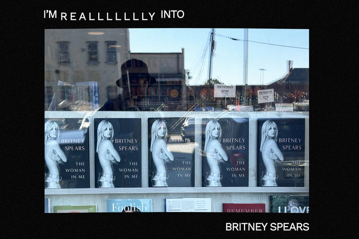 Copies of Britney Spears' book <em>The Woman In Me</em> in a book store window.