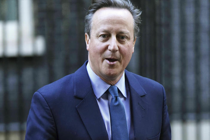 Britain's former prime minister David Cameron leaves Downing Street in London on Monday.