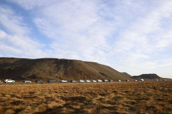 A line of cars queued on a road heading to the town of Grindavik, Iceland, Monday.