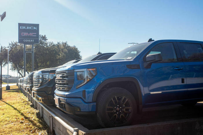 GMC pickup trucks on a lot at a General Motors dealership in Austin, Texas. The average U.S. passenger vehicle has gotten about 8 inches taller in the last 30 years, according to the Insurance Institute for Highway Safety.