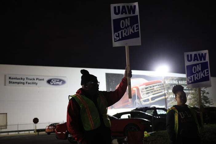 Workers form a picket line outside the Ford Motor Co. Kentucky Truck Plant in the early morning hours on October 12, 2023 in Louisville, Kentucky. This week, a majority of workers at the plant voted no on the tentative contract deal.