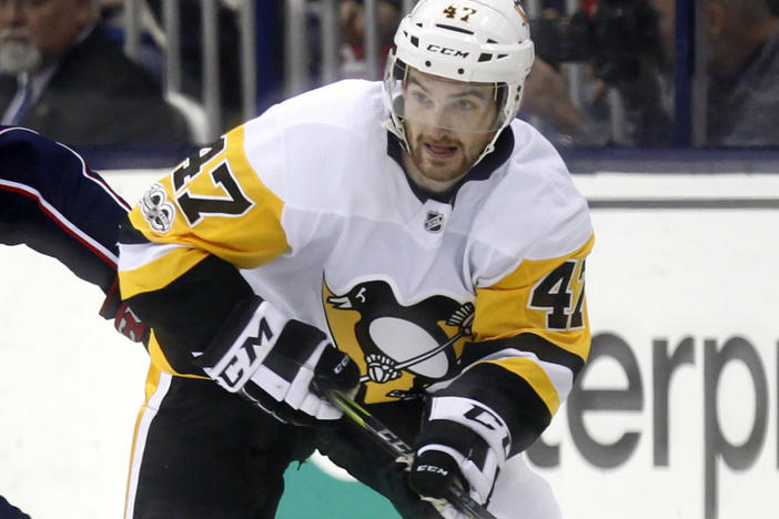 Former Pittsburgh Penguins forward Adam Johnson in action during an NHL game in Columbus, Ohio, in 2017. Police in England arrested a man Tuesday on suspicion of manslaughter in connection to Johnson's death in October.