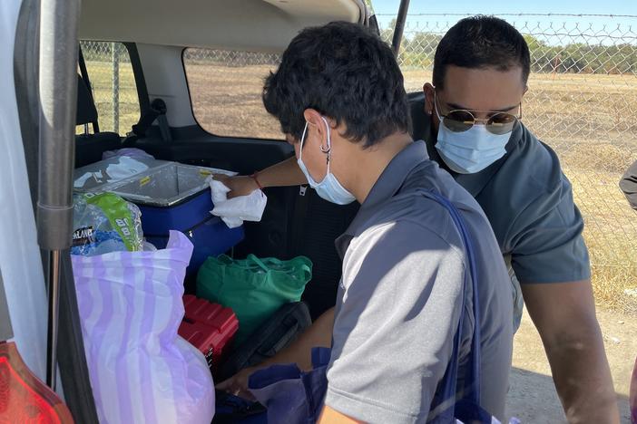 Community health worker Hector Gallegos and nurse Jose Lopez gather supplies to treat homeless patients in Modesto, California.