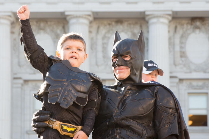 Batkid Miles Scott, center, received a key to the city from San Francisco Mayor Ed Lee, left, on Nov. 15, 2013.