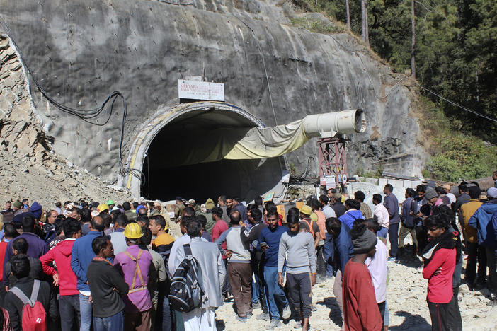 People watch rescue and relief operations at the site of an under-construction road tunnel that collapsed in mountainous Uttarakhand state in India on Wednesday, Nov. 15, 2023. Rescuers have been trying to drill wide pipes through excavated rubble to create a passage to free 40 construction workers trapped since Sunday.