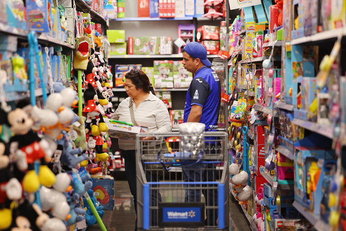 People shop ahead of Black Friday at a Walmart Supercenter on Tuesday in Burbank, Calif.