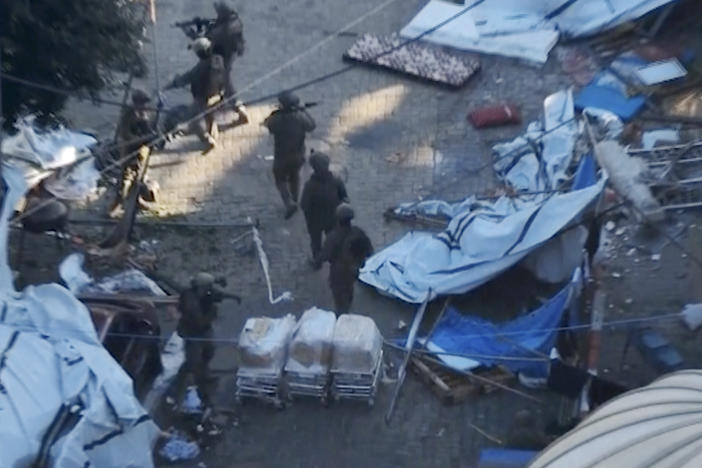 Israeli troops operate on the grounds of the Al-Shifa hospital in Gaza City in this photo released by the Israeli military. The Israelis say they found weapons belonging to Hamas, but did not provide details. Hamas denied the claim that it has been operating in or underneath the hospital.