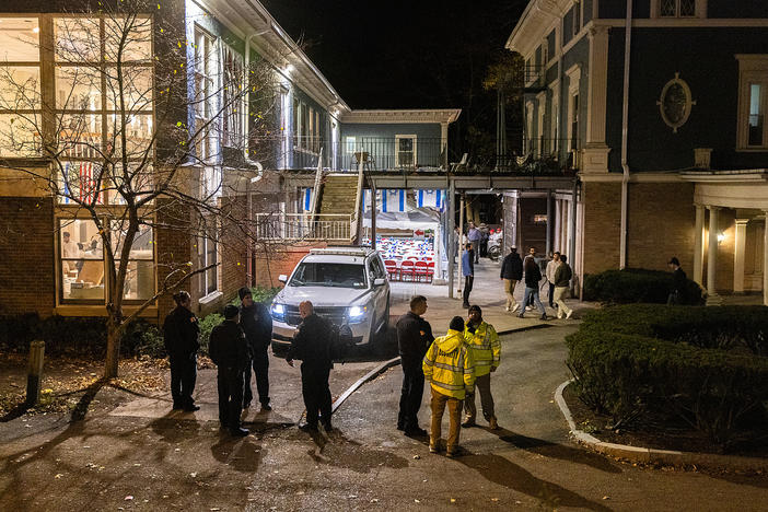 Police and security stand outside the Center for Jewish Living at Cornell University on Nov. 3 in Ithaca, New York. The university canceled classes after one of its students is accused of making violent antisemetic threats.