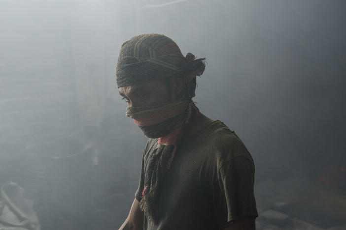 A worker in a Bangladeshi lead mill, without safety protection. A new analysis finds the death toll from lead exposure is about six times higher than the previous estimate.