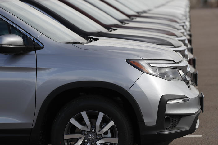 A long line of unsold 2019 Pilot SUVs sits at a Honda BMW dealership in Highlands Ranch, Colo. on Nov. 28, 2018.