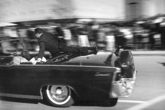 Secret Service agent Clint Hill rides on the back of the presidential limousine moments after President John F. Kennedy was shot on Nov. 22, 1963.