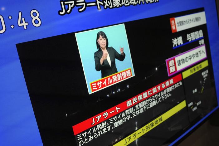 A TV shows a J-Alert or National Early Warning System to Japanese residents on Tuesday in Tokyo. North Korea launched a rocket in its third attempt to put a spy satellite into orbit, according to South Korea's military.