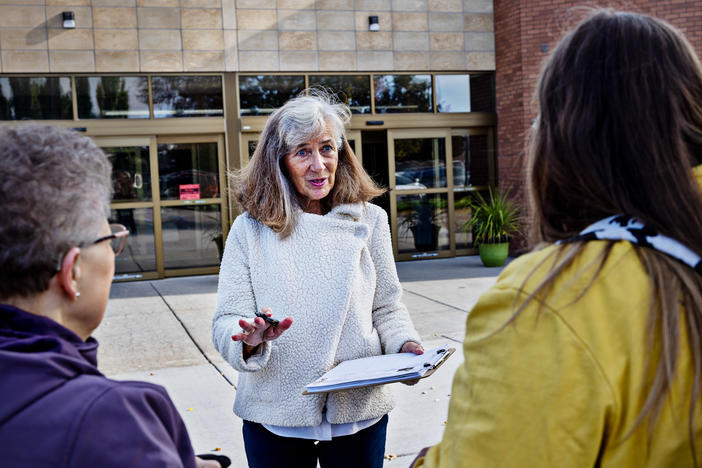 Parents Against Bad Books co-founder Carolyn Harrison (center) talks with people last month outside the public library in Idaho Falls, Idaho, about what she considers obscene books on the shelves.