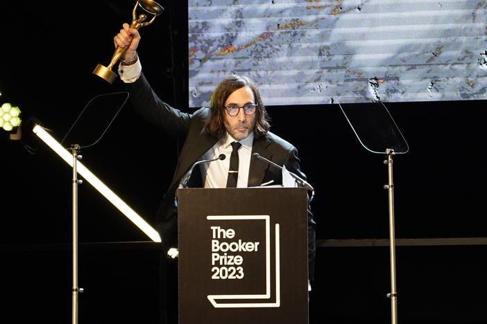 Paul Lynch, winner of the 2023 Booker Prize, celebrates shortly after the announcement in London on Sunday.