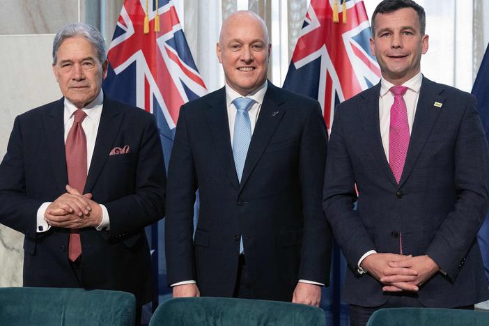 New Zealand's new Prime Minister Christopher Luxon, center, formed a coalition government with Winston Peters, left, the leader of the New Zealand First party, and David Seymour, leader of ACT New Zealand.