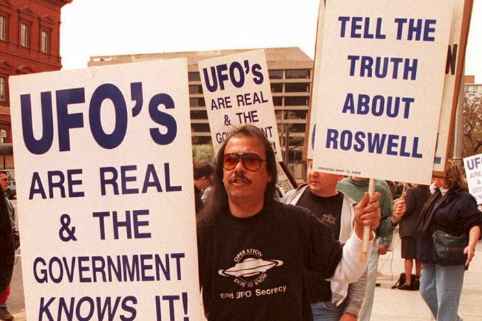 A group of protestors march in front of the General Accounting Office on March 29, 1995, to raise awareness about the mysterious object that was found in Roswell, N.M., in 1947.
