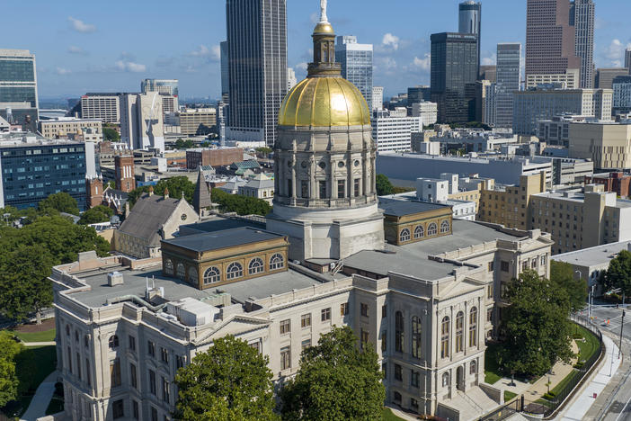 The Georgia Capitol is seen on Aug. 27, 2022, in front of the Atlanta skyline. State lawmakers will gather Wednesday to start work on new political district maps.