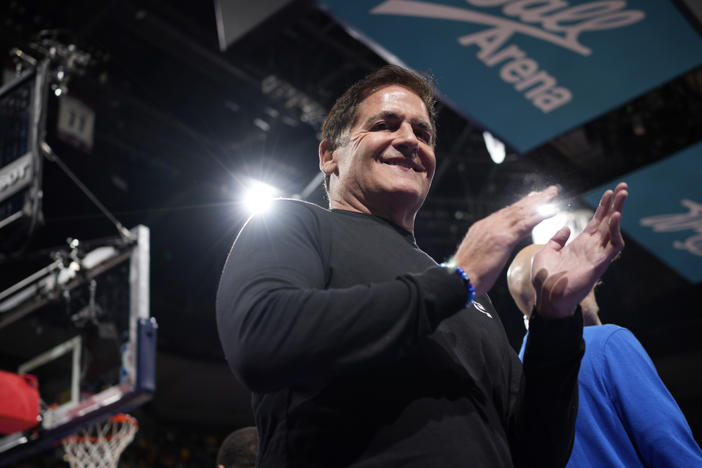 Dallas Mavericks owner Mark Cuban applauds as Mavericks are introduced for an NBA against the Denver Nuggets on Friday, Nov. 3, 2023, in Denver. Cuban is reportedly in talks to sell his stake in the team to the Miriam Adelson, widow of Las Vegas casino magnate Sheldon Adelson.