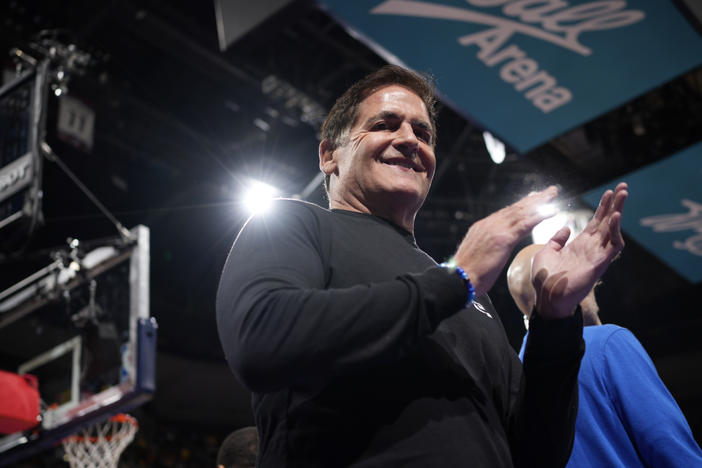 Dallas Mavericks owner Mark Cuban applauds as Mavericks are introduced for an NBA against the Denver Nuggets on Friday, Nov. 3, 2023, in Denver. Cuban is reportedly in talks to sell his stake in the team to the Miriam Adelson, widow of Las Vegas casino magnate Sheldon Adelson.