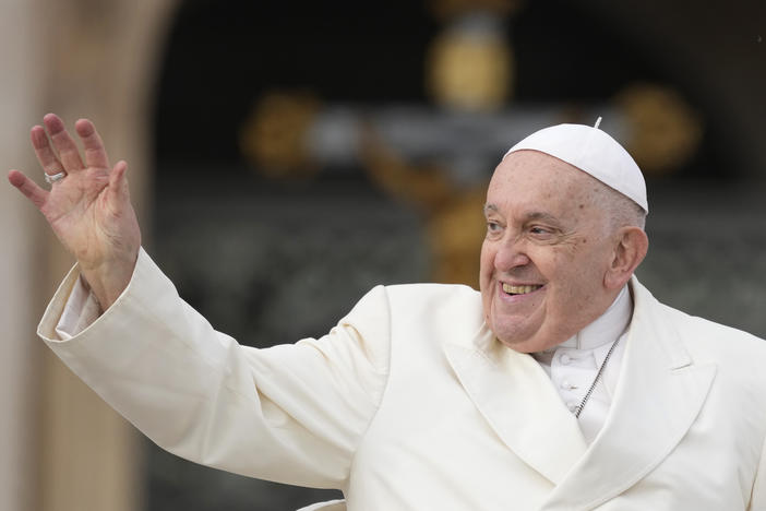 Pope Francis waves to the  faithful at the end of his weekly general audience in St. Peter's Square at the Vatican on Wednesday, Nov. 22, 2023. The pope, who will turn 87 next month, canceled his trip to Dubai for the U.N. climate conference on doctors' orders.