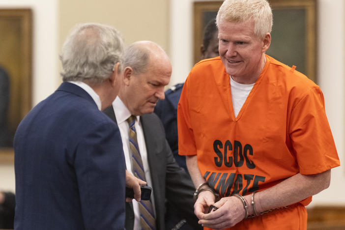 Alex Murdaugh, right, talks with his attorneys Dick Harpootlian, left, and Jim Griffin during his sentencing for stealing from 18 clients on Tuesday, Nov. 28, 2023, at the Beaufort County Courthouse in Beaufort, S.C.