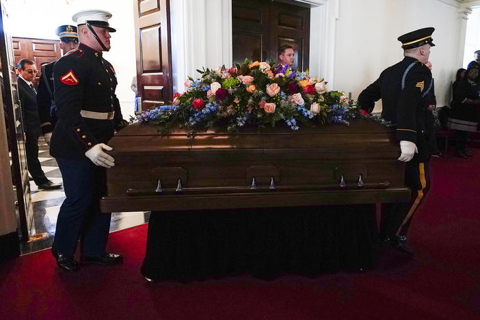An Armed Forces body bear teams moves the casket for former first lady Rosalynn Carter into Glenn Memorial Church at Emory University for a tribute service on Tuesday, Nov. 28, 2023, in Atlanta.