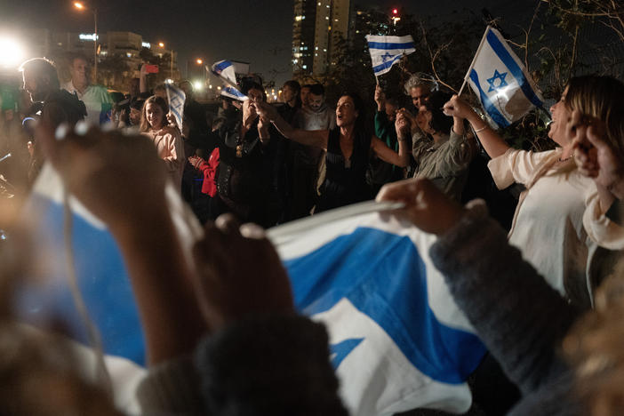 Israelis gather to witness the first batch of released hostages being brought to Schneider Hospital via helicopter on Nov. 24.