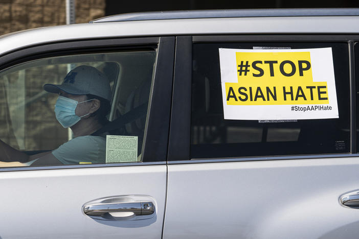 Members of the Korean American Federation of Los Angeles drive with signs reading: "#Stop Asian Hate," in a caravan around Koreatown to denounce hate against the Asian American and Pacific Islander communities in Los Angeles on March 19, 2021.