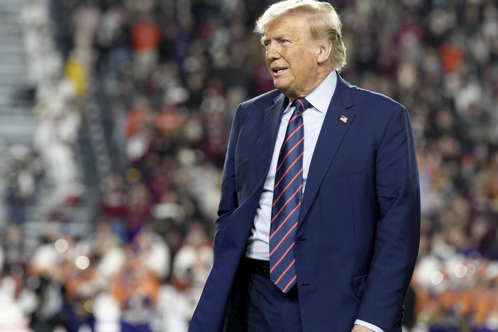 Republican presidential candidate and former President Donald Trump stands on the field during halftime in an NCAA college football game between the University of South Carolina and Clemson Saturday, Nov. 25, 2023, in Columbia, S.C.