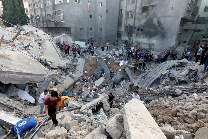 Palestinians search the destroyed annex of the Church of Saint Porphyrius, damaged in a strike on Gaza City on Oct. 20.