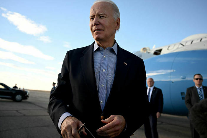 President Biden speaks to reporters before boarding Air Force One at Pueblo Memorial Airport in Pueblo, Colo., on Nov. 29.