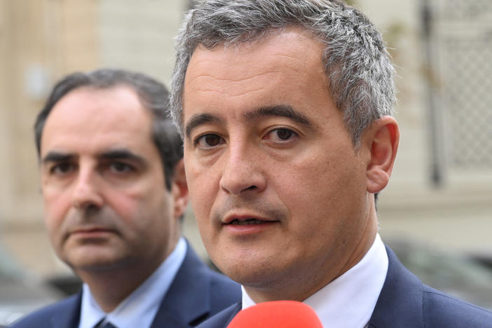 FILE - French Interior Minister Gerald Darmanin, right, talks to the media after a meeting on Oct. 9, 2023, in Paris. French police arrested a man who targeted passersby in Paris on Saturday night, Dec. 2, 2023, killing a German tourist with a knife and injuring two others, France's Interior Minister Darmanin said.