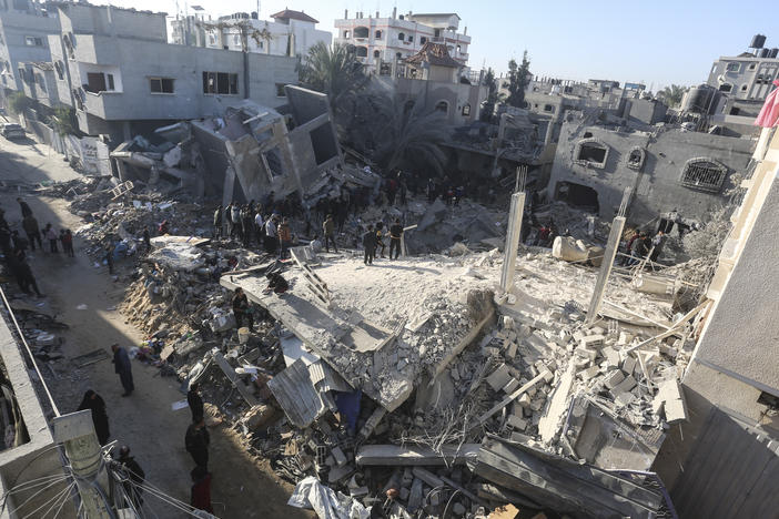 Palestinians look for survivors of the Israeli bombardment of the Gaza Strip in Rafah, on Sunday.