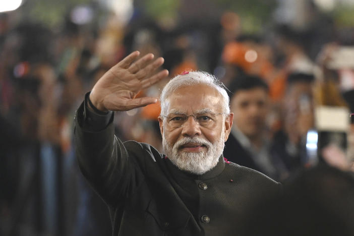 Indian Prime Minister Narendra Modi greets party worker during celebrations following Bharatiya Janata Party's victory in the state elections at the BJP headquarters in New Delhi, India, Sunday, Dec. 3, 2023.