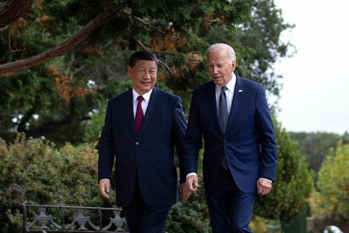 President Joe Biden and Chinese President Xi Jinping walk together after meeting in November.