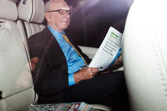 Rupert Murdoch, shown in London in July 2011, sought for years to acquire full control of Sky. His British newspaper arm now faces allegations its tabloids hacked into Cabinet ministers' voice mails to pressure them to allow the deal to go through.