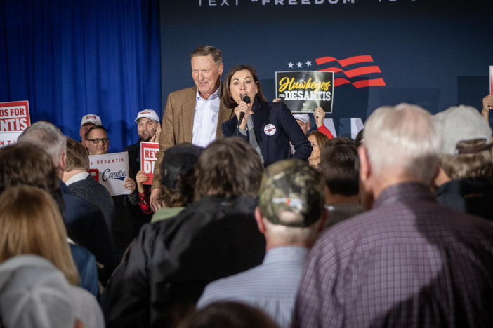Iowa Gov. Kim Reynolds and influential Iowa evangelical Christian leader Bob Vander Plaats speak ahead of Florida Gov. Ron DeSantis's speech upon completing his 99 county tour of Iowa in Newton, Iowa.