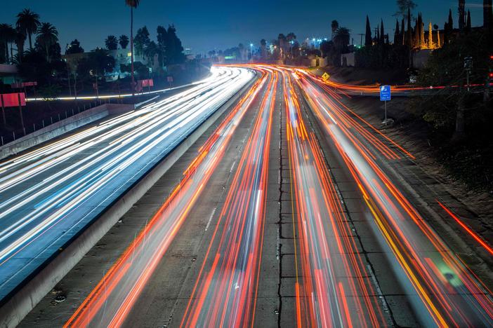 Cars and trucks move slowly during evening rush hour on the Hollywood Freeway in Los Angeles, Calif. in 2014.