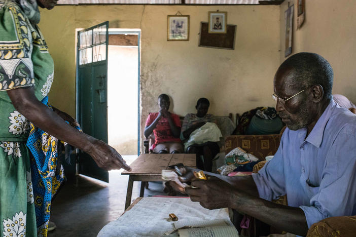 A 2017 meeting of a rotating savings club formed in a village near Lake Victoria soon after every adult there was chosen to receive a monthly through GiveDirectly's experiment. The clubs have enabled recipients to convert their grants into lump sum payments: Each month the members put $10 into the communual pot — for a total of $100 — and a different person takes it home.