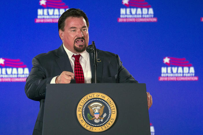 Nevada Republican Party Chair Michael McDonald announces then-President Donald Trump before he speaks at the party's convention on June 23, 2018, in Las Vegas.